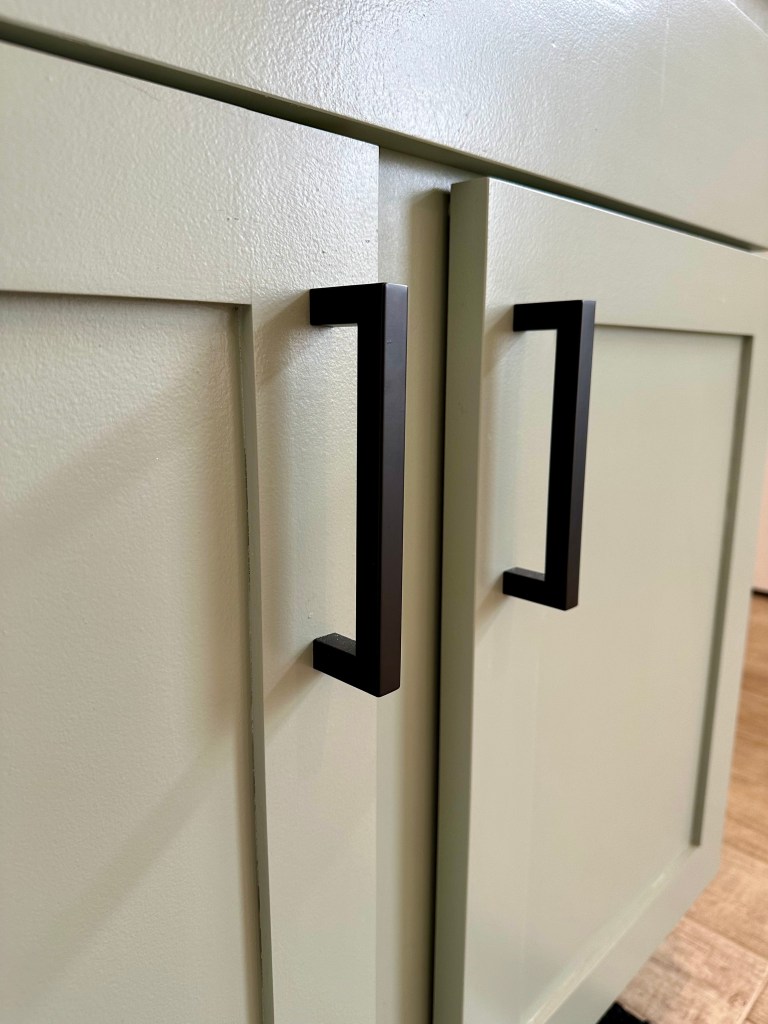 Modern Cabinet Hardware Installed Onto Shaker Style Cabinet Doors