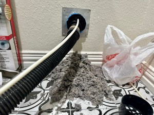 Dryer vent cleaning removing large lint buildup from vent hose
